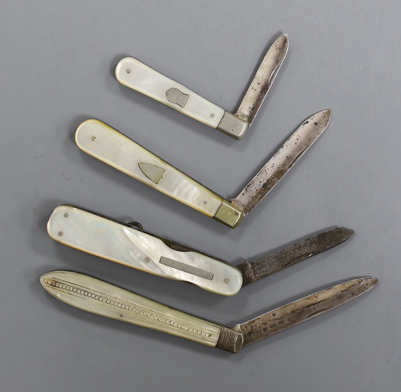 Four Victorian mother of pearl fruit knives, with silver blades